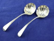 A pair of George III silver Old English pattern sauce ladles, with scalloped bowls, possibly Richard