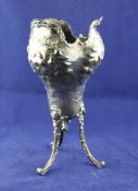 An early 20th century French 950 standard silver tripod vase, of baluster trefoil form, embossed