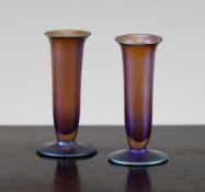 A pair of WMF miniature Myra iridescent glass vases, each of slender trumpet form with a domed foot,