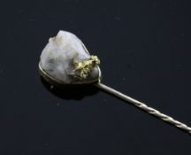 A gold nugget mounted gold stick pin, 3.5in.