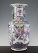 A Chinese famille rose baluster vase, late 19th century, painted with reserves of figures in