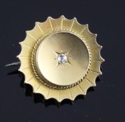 A Victorian gold and diamond set flowerhead locket brooch, 1in.