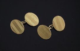 A pair of George V engine turned 18ct gold oval cufflinks, 13.6 grams.