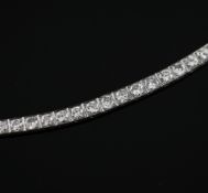A platinum and diamond line bracelet, set with thirty one brilliant cut stones graduated from 0.