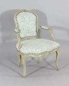 A Louis XV carved and painted beech fauteuil, late 18th century, with blue printed floral fabric