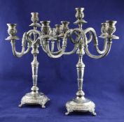 A pair of 20th century Portuguese 916 standard silver four branch five light candelabra, with turned