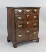 A George II crossbanded walnut chest of three short and three long drawers, on bracket feet, 3ft x