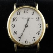 A lady`s 1960`s 14ct gold Concorde manual wind wrist watch, retailed by Tiffany & Co, with oval