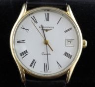 A gentleman`s modern 9ct gold Longines quartz wrist watch, with Roman dial and date aperture.