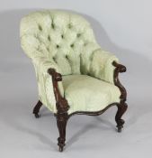 A Victorian carved walnut button back salon chair, with scroll end arms on cabriole legs and