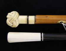 A Victorian carved marine ivory and malacca walking cane, with knot handle, and an ivory and ebony