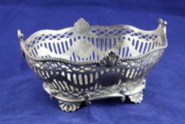 A late Victorian pierced silver sweetmeat bowl, by Charles Stuart Harris, of oval form, with
