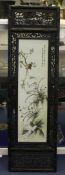 A Chinese famille rose and wood framed wall plaque, decorated with birds and butterflies amid