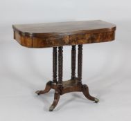 A Regency mahogany and rosewood crossbanded tea table, on four spiral turned column supports,