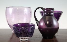 Four amethyst glass vessels, including a Leerdam jug designed by H.D.Copier, etched mark, 7.25in., a