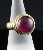 A Theo Fennell 18ct gold rubellite dress ring, with cabochon cut stone, size P; boxed