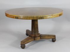 A William IV rosewood circular breakfast table, on a turned column platform and gadrooned bun