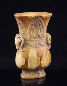 A walrus ivory archaistic vase, of oval baluster section, carved with lappets and taotie masks and