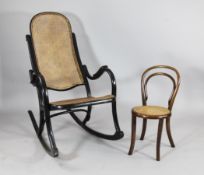 A Thonet ebonised rocking chair, with caned back and seat, stamped; and a bentwood childs chair (2)