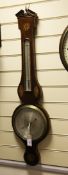 An early 19th century inlaid mahogany wheel barometer, with silvered dial engraved D. Della Torre,