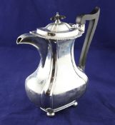 An Edwardian silver hot water jug, of shaped rectangular form, with fluted angles, John Round &
