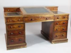 A Victorian mahogany Dickens desk, with two drawers and writing slope above nine short drawers, on