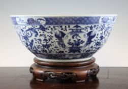 A large Chinese blue and white bowl, Kangxi mark, late 19th century, the interior painted with a