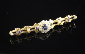 A gold sapphire and diamond cluster set bar brooch, 2.5in.