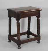 A late 17th century style oak joint stool, with ring turned legs and stretchered base, 1ft 10.5in. x