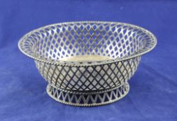 A George V pierced silver circular bowl, with lattice body and ropetwist rim, on pierced foot, C.