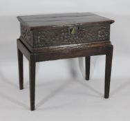 A late 17th century carved oak bible box, on later stand, 2ft 3in. x 2ft 4in. x 1ft 6in.