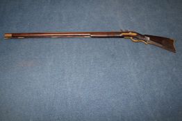 A Pennsylvania flintlock Kentucky long rifle, 19th century, with 39in. octagonal .44 calibre barrel,