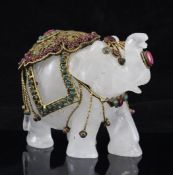 An Indian white quartz and jewelled brass mounted model elephant, 4in.