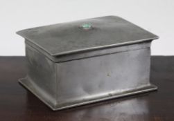 A Liberty Tudric pewter cigarette box, set with a green hardstone cabochon, stamped Tudric and no.