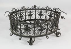 An oval wrought iron jardiniere, Italian, 17th century, of pierced form with leaves enclosed