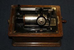 An Edison Standard Phonograph, with model C reproducer, horn and seventeen cylinders, No S255859,