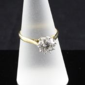 A 1970`s 18ct gold and platinum solitaire diamond ring, the stone approximately 1.50ct, size O.