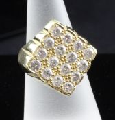 A 1980`s 18ct gold and diamond set dress ring, the diamond shaped setting set with sixteen brilliant