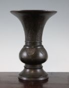 A large Chinese bronze beaker vase, Gu, 17th / 18th century, the neck and body with calligraphic