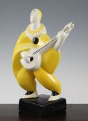 Geo. Conde (1891-1980). A pottery figure of a Pierrot playing the mandolin, with crackle glaze