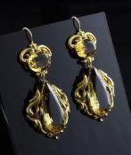 A pair of ornate gold and citrine drop earrings, with tear shape and oval cut stones, 2in.
