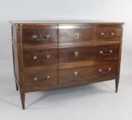 A 19th century French fruitwood breakfront commode, with three drawers, with fluted corner pilasters