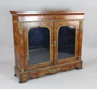 A Victorian marquetry inlaid burr walnut display cabinet, with two doors on bracket feet, 3ft 8.5in.