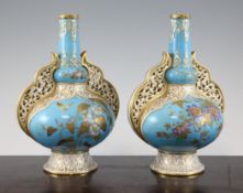 A pair of Crown Derby bottle vases, c.1880, the shapes inspired by Islamic mosque lamps, painted