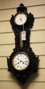 A Victorian black painted cast iron wall clock, with combined aneroid barometer and thermometer,