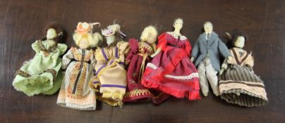 A set of seven Victorian miniature wax dolls, in various costume, largest 5in.