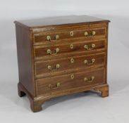 A George III mahogany and Gonzales Alves crossbanded chest, of four graduated long drawers, on