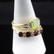 An Edwardian 18ct gold, garnet and diamond set ring, with carved setting, size S, together with a
