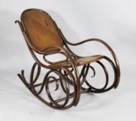 A late 19th century bentwood rocking chair, in the manner of Thonet, with panelled back and seat
