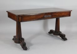 A William IV rosewood library table, with two drawers, on circular legs and carved paw feet, 2ft